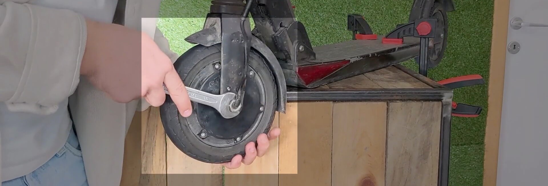 Removing the wheel from the electric scooter